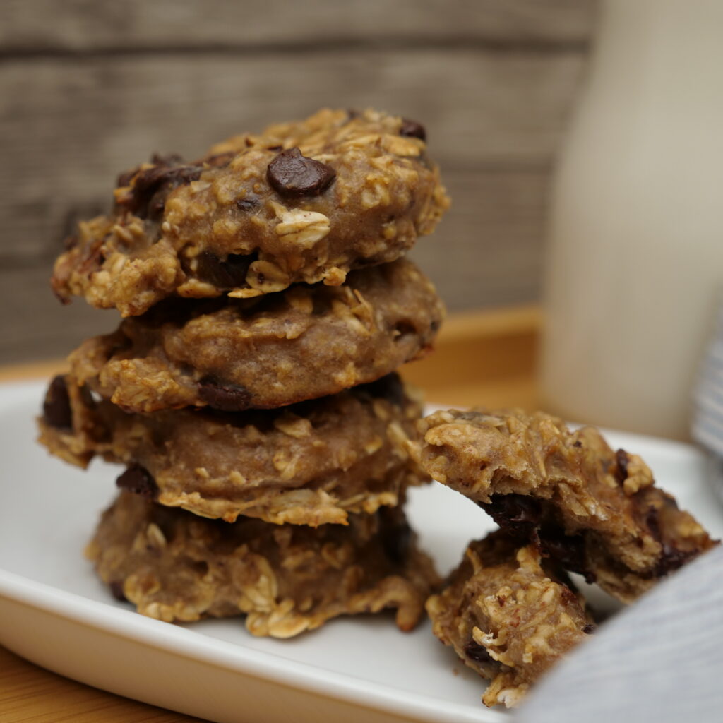 4 High Protein Banana Cookies stacked on a plate